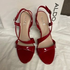 New in original box Aldo red patent sandal.